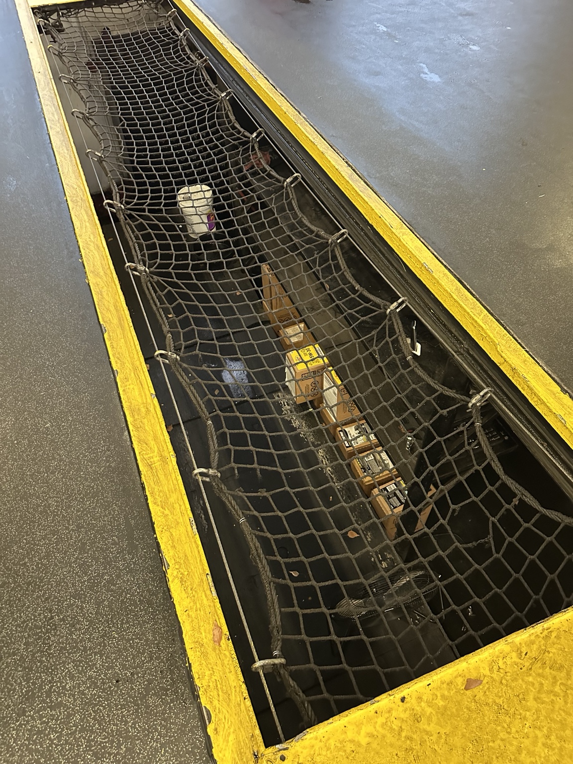 Existing rope bay net with open mesh, a sagging profile, and visible gaps along the edges